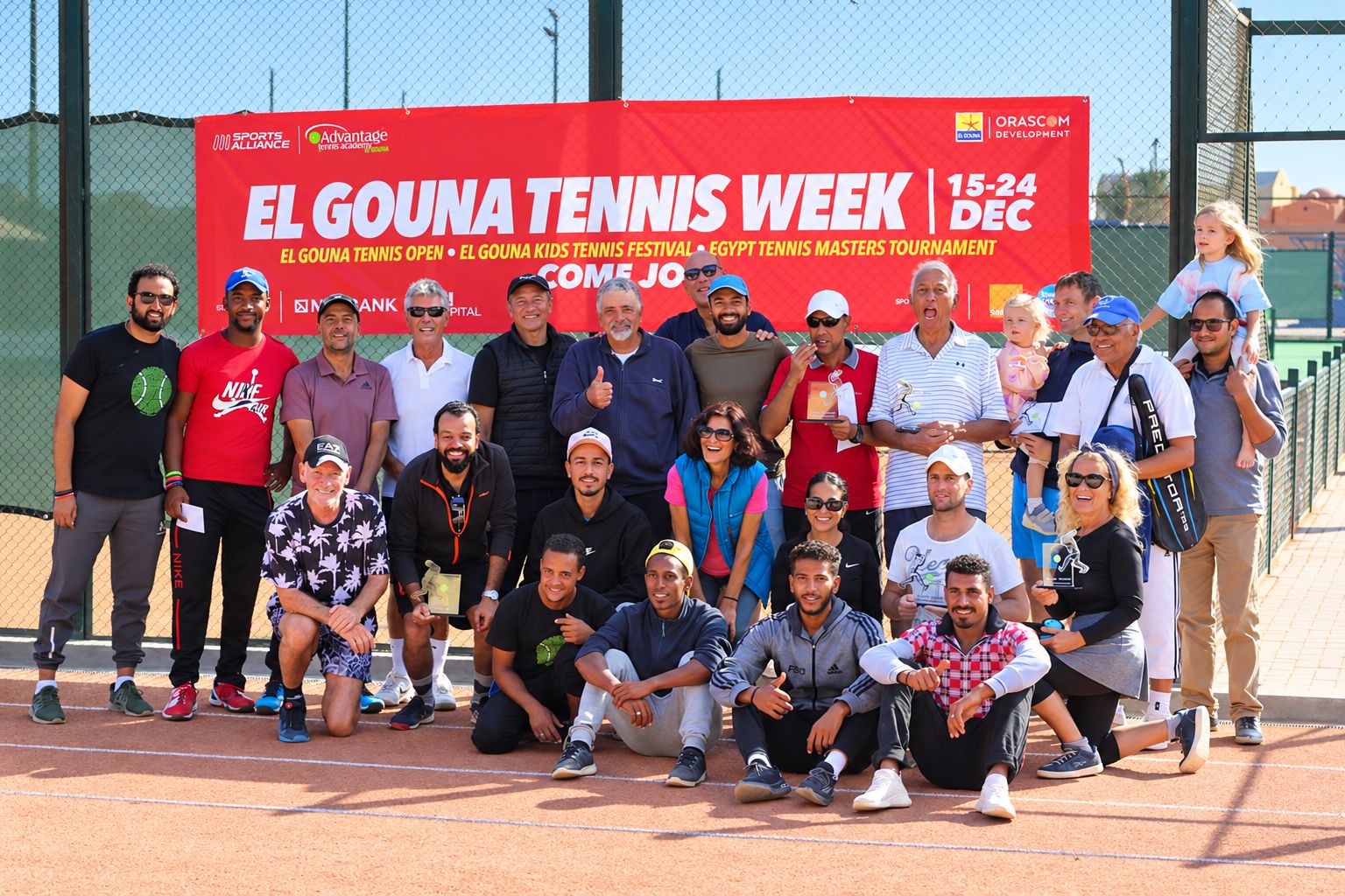 Players, families and winners with trophies at El Gouna Tennis Week